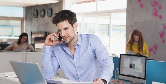 Man using Wholesale Business Internet in small business