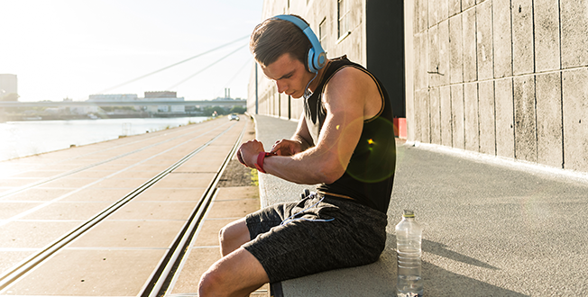 Man checking his health watch after a workout