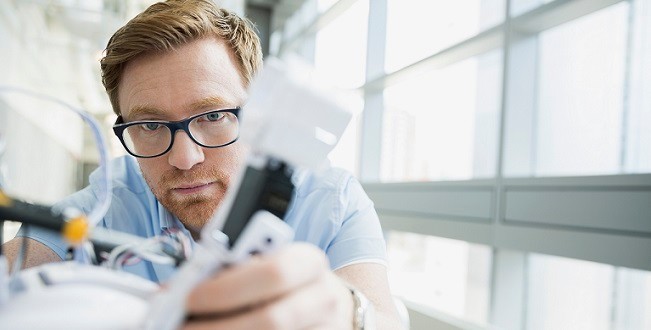 Engineer testing a robot