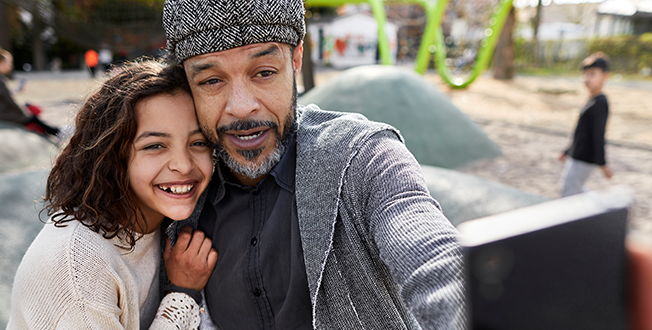 Man and daughter taking a selfie